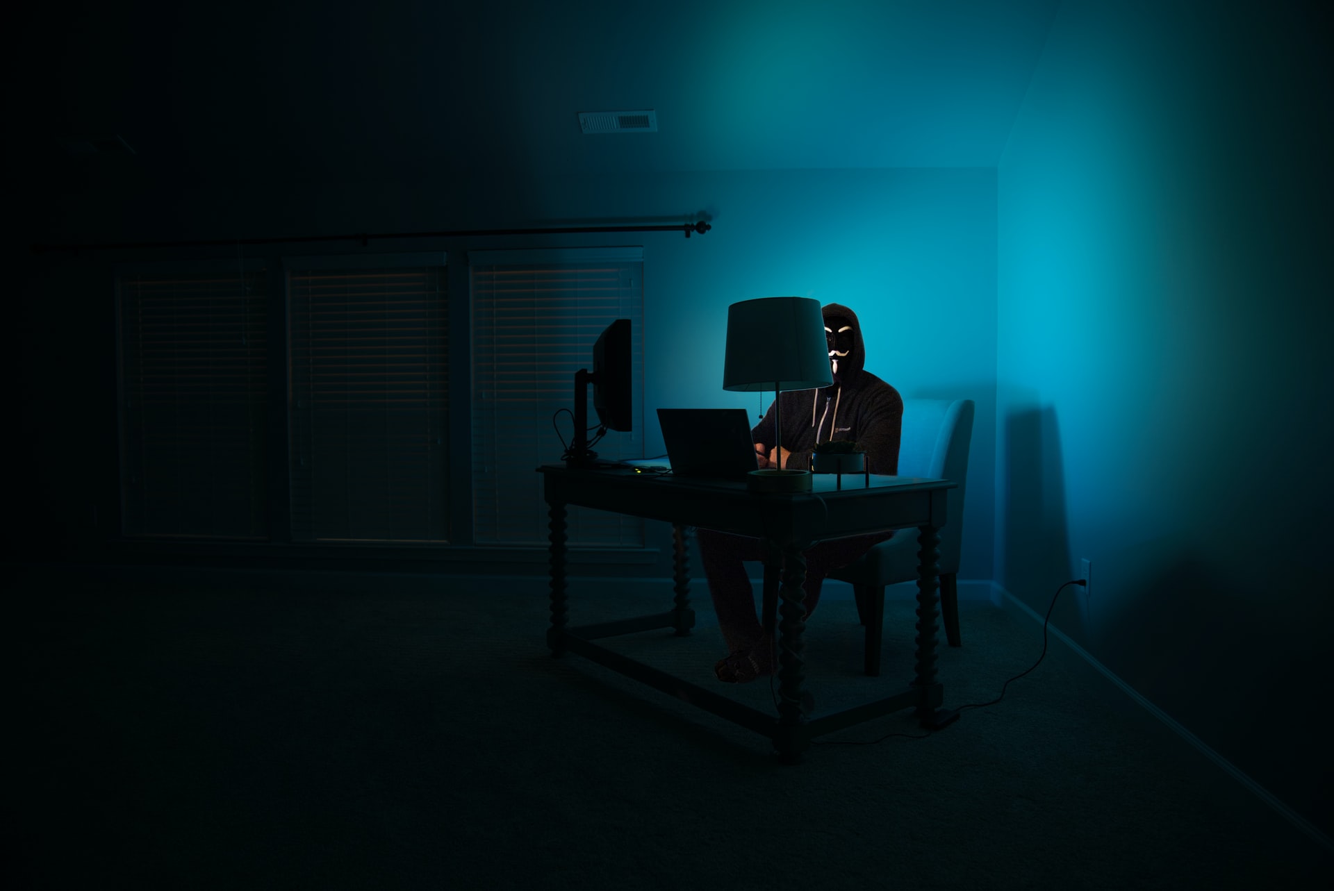Picture of a hacker in the corner